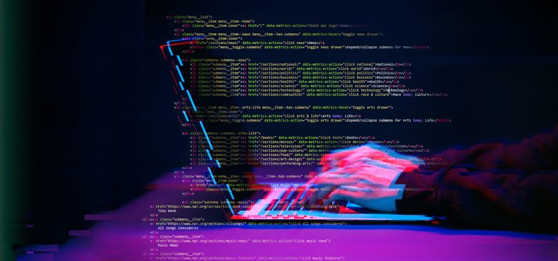 A pictorial representation of DarkCloud Stealer. Hands type on a laptop. The image is overlaid with code containing syntax highlighting. The image has a glitch effect, suggesting cybersecurity or a cyber attack.